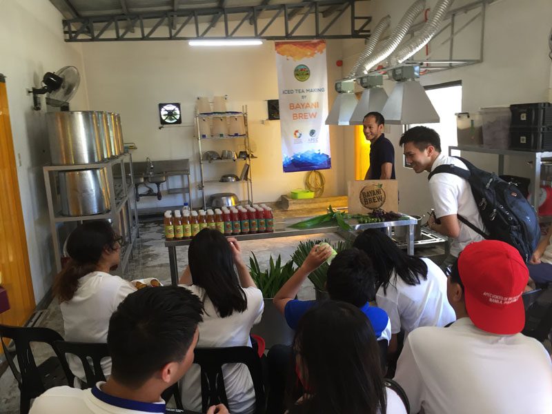 APEC VOF delegates learn how Bayani Brew, a tea that is one of the farm's social entrepreneurship projects, is made