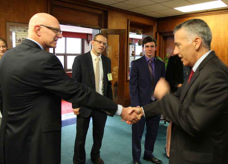 Political Science professor Cleve Fraser greets Ambassador Goldberg upon arrival