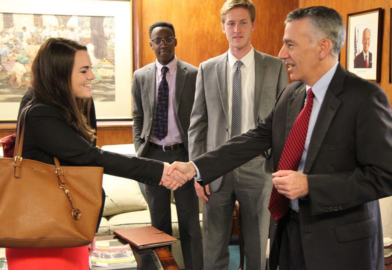 Student Kelsey Orr meets Ambassador Goldberg upon arrival at the embassy.