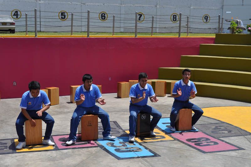The students from the Escuela de Talentos demonstrating how to play their traditional drum