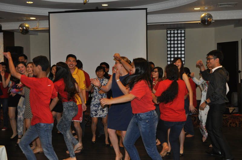 The Voices students from Peru dancing with other delegates