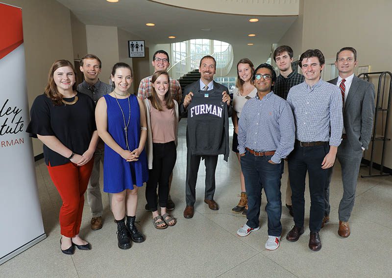 Chuck Todd with the graduating Advance Team seniors: (l-r) Elizabeth Campbell, Noah Zimmermann, Lucy Lansing, Emma Jackson, Christian Alexandrou, Chuck Todd, Emma DeVenny, Sulaiman Ahmad, Matthew Sanders, Matthew Deininger and Liam Simkins‐Walker