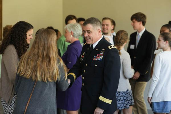 Chris Ballard '84, commanding general, U.S. Army Intelligence and Security Command, speaking with one of the Hollingsworth students