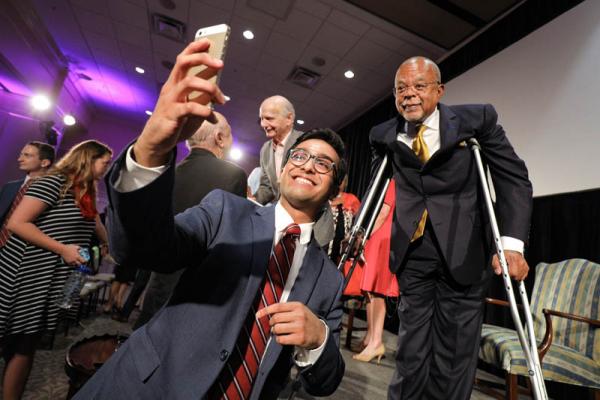 Advance Team member Sulaiman Ahmad taking a selfie with Henry Louis Gates