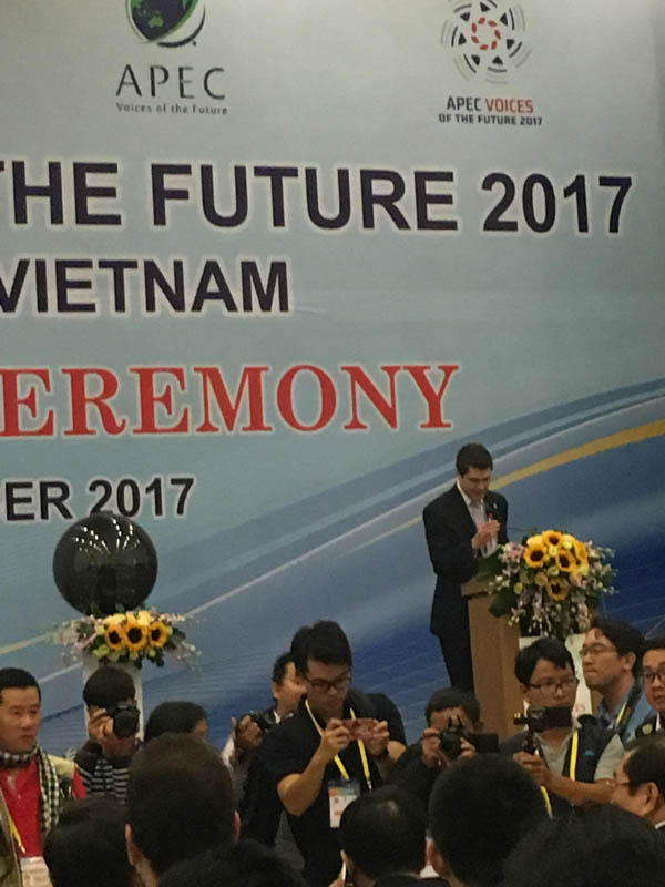 Peyton Roth moderating the opening ceremonies of the APEC Voices of the Future program