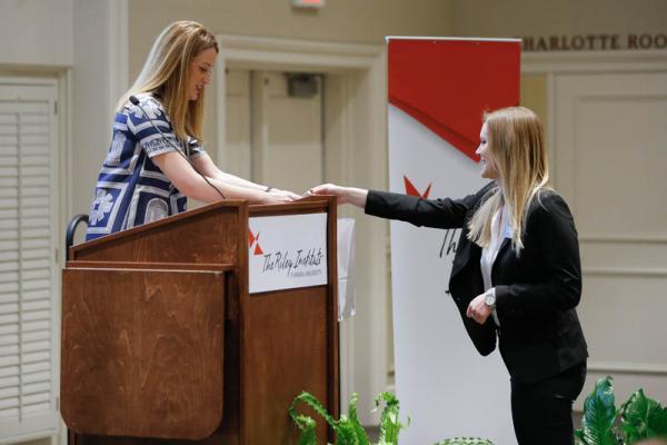 Shannon Cherney presenting a gift to Roberta Metsola, member of European Parliament (MEP) for Malta and member of the European People’s Party (EPP) Partit Nazzjonalista
