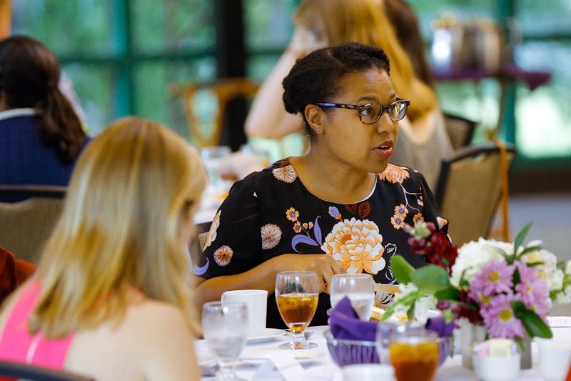 Dr. Shaniece Criss, pictured here, converses with the freshman scholars at the Welcome Dinner of the Advantage Scholars program