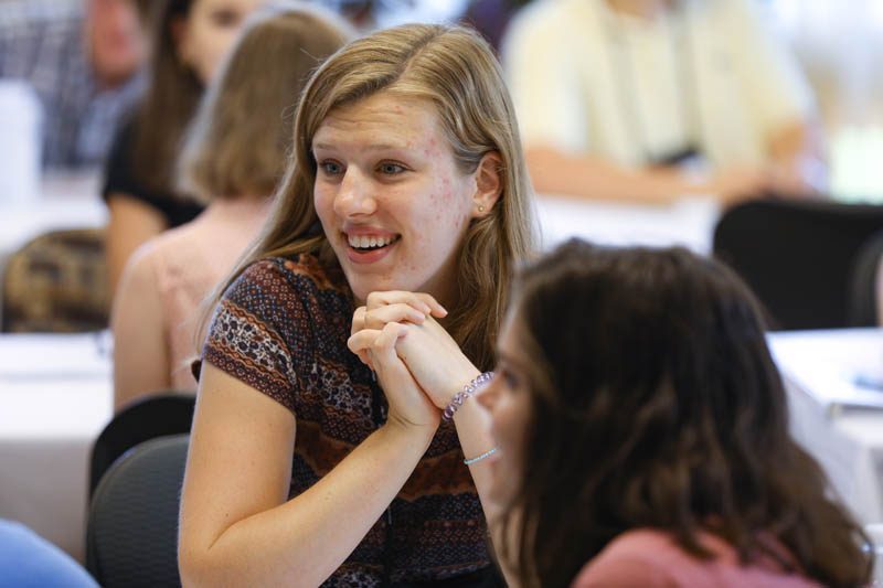 Lindsey Cottle chats with other scholars during the lunch at the Shi Center for Sustainability