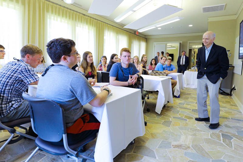 The scholars attentively listen to Secretary Riley at the Shi Center for Sustainability