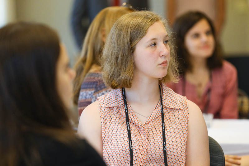 Maddie Klumb attentively listens to Secretary Riley at the Shi Center for Sustainability