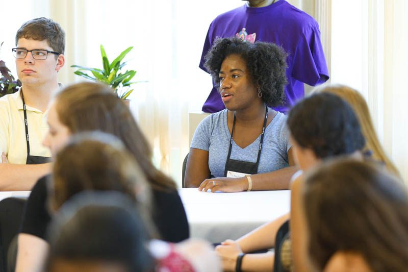 Andrew Riccardi and Shekinah Lightner attentively listen to Secretary Riley at the Shi Center for Sustainability