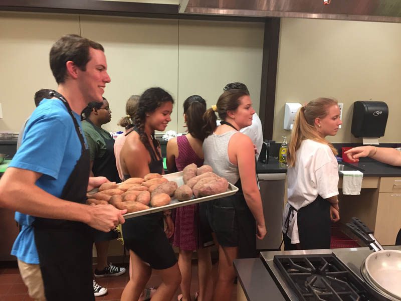 The scholars are pictured here in a cooking class