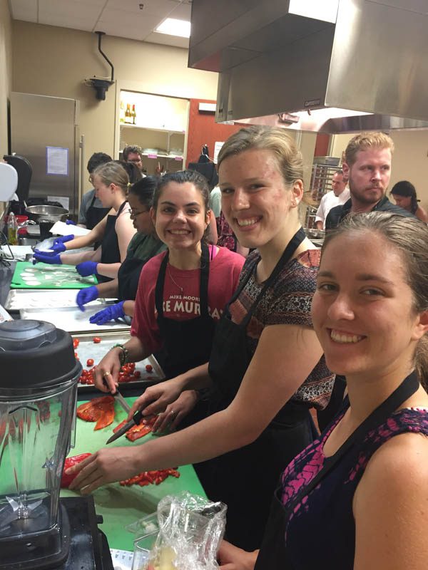 Amber Jacobsen, Lindsey Cottle, and Morgen Smith are pictured here in a cooking class