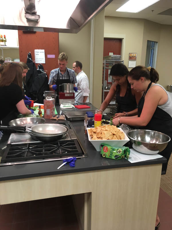 The scholars are seen here during a cooking class