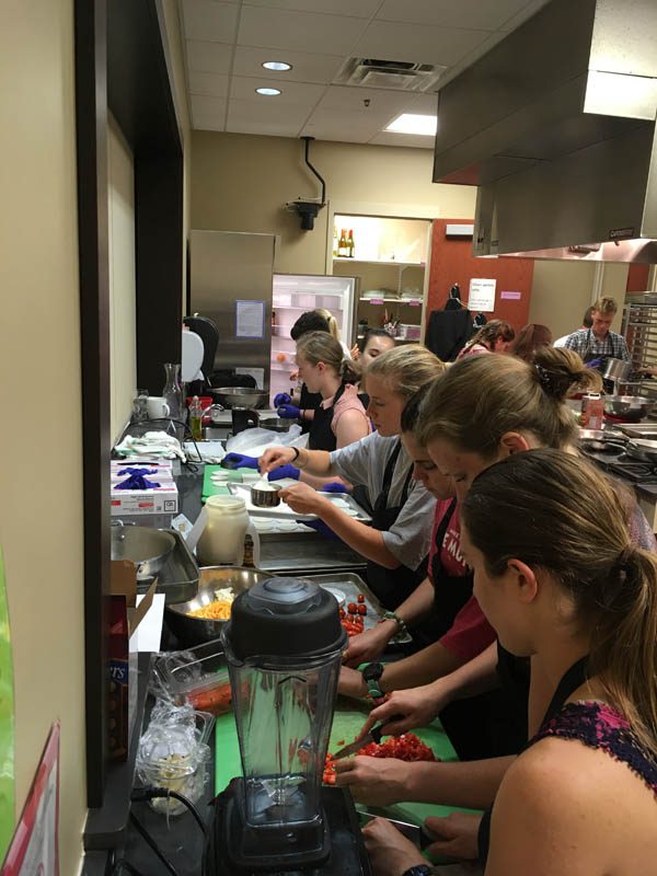 The scholars are seen here during a cooking class