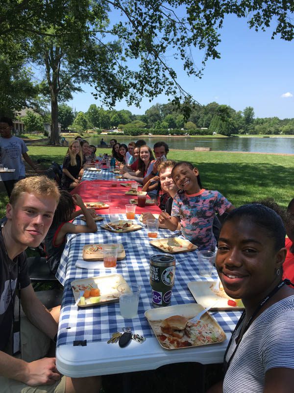 The scholars are pictured here at the picnic lunch with students from Poe Mill Achievement Center