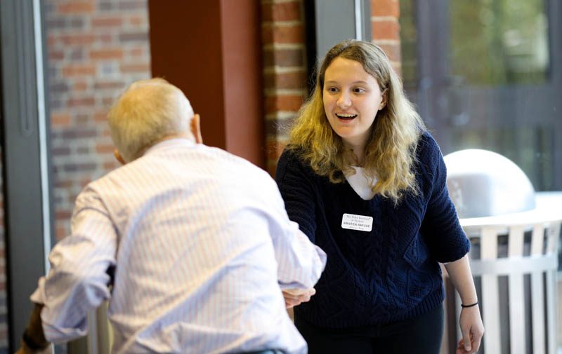 Advance Team member Kristen Rafuse ('19) introducing herself to Peter Hart