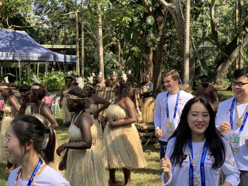 Student delegates, including David Cousar, learning the traditional cultural dance