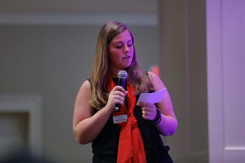 StraightTalk 2019: Questions for the speakers were collected from the audience. Advance Team member Frazier Beall '20 is presenting the question to the speakers.