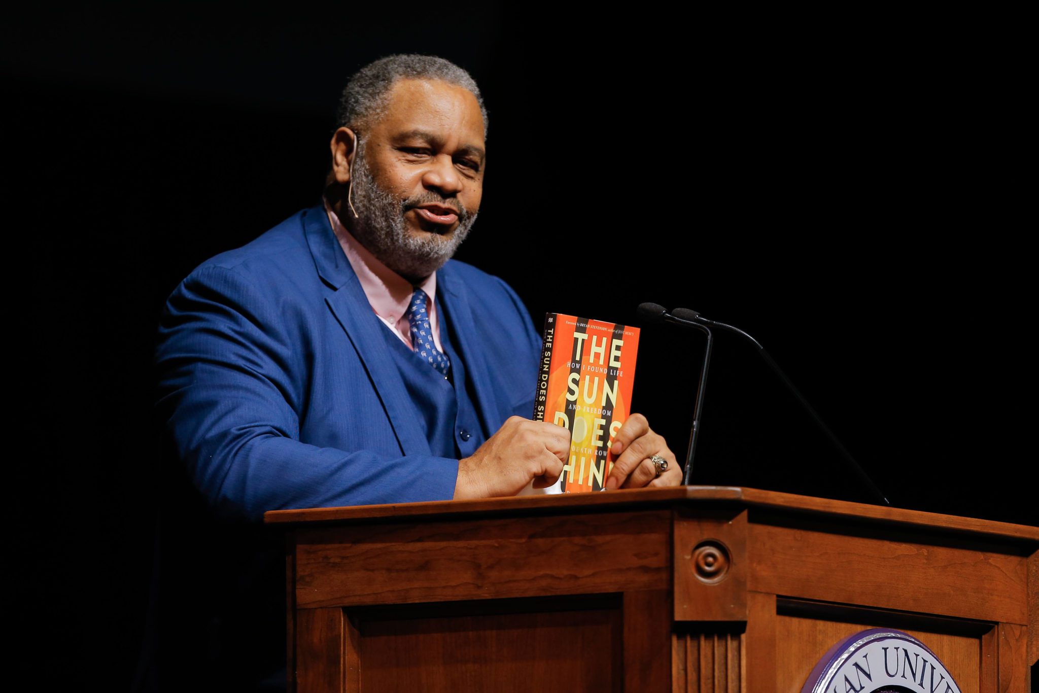 Speaker Anthony Ray Hinton stands behind podium