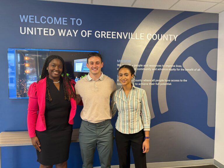 Gabrielle Harvey poses with two other people at United Way.
