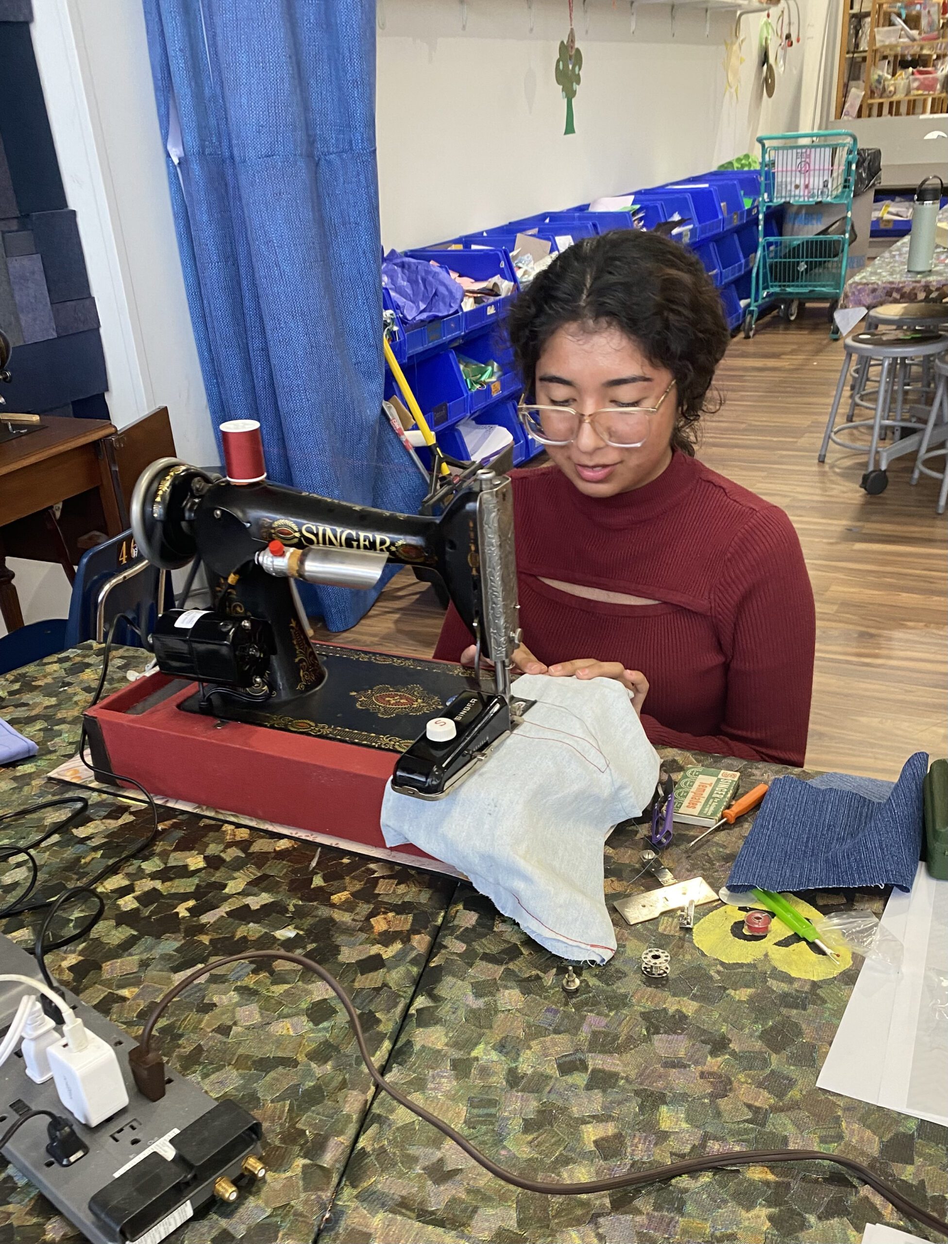 Student using a sewing machine.