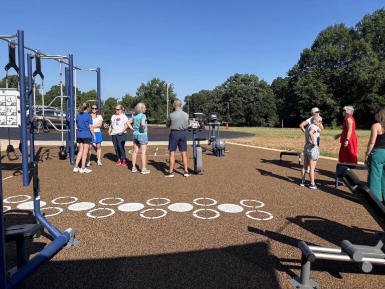 Several students stand at public playground