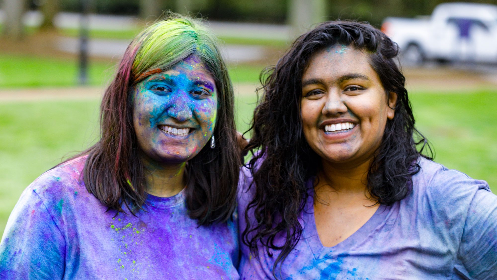 Students with paint on their faces after Holi celebrations