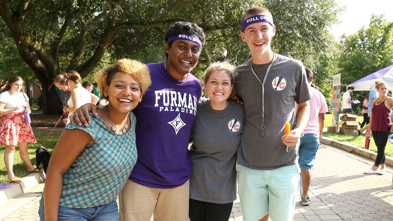 Students standing together in arms
