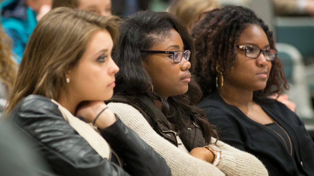 Students listening to speakers