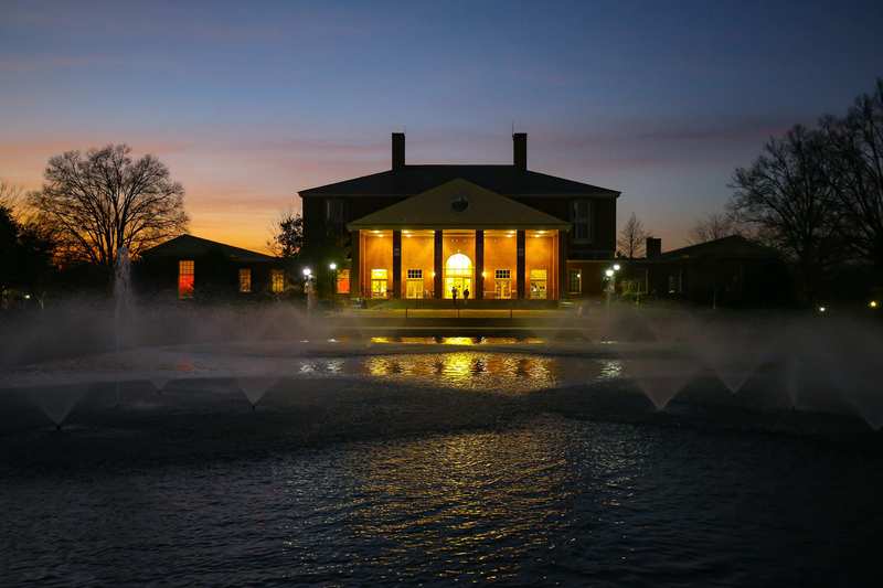 James B. Duke Library as seen from the fountains at night.