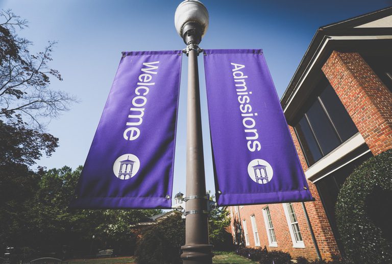 Welcome Admissions, flags in front of Hartness