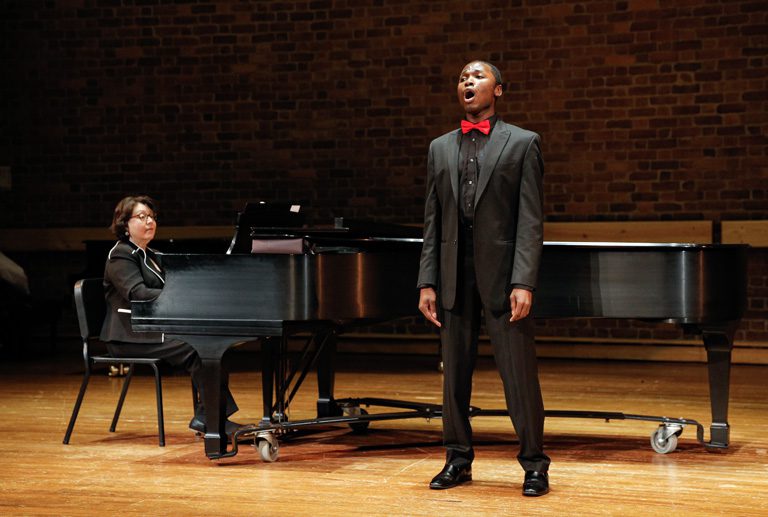 Student performing their recital in the music building