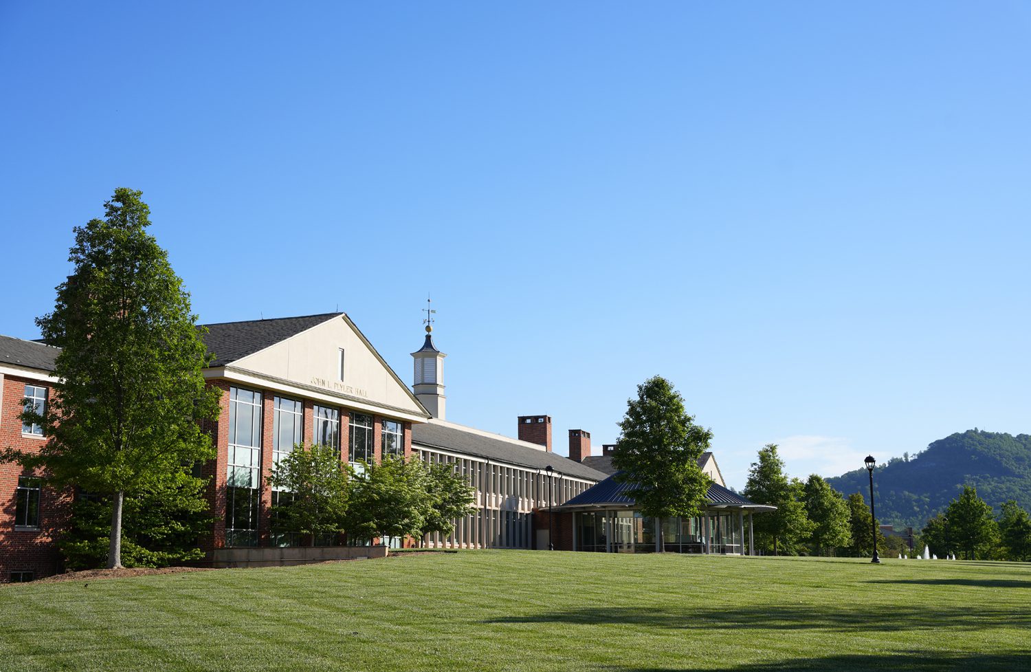 John L. Plyler Hall with Paris Mountain in the background