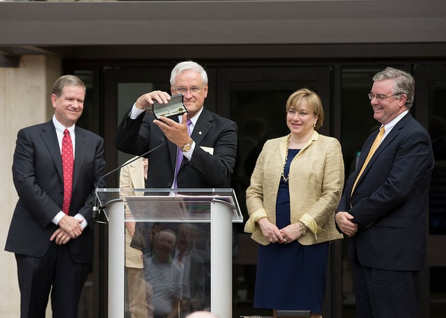 President Carl Kohrt '65 presents keys to the building to donors Robert '83 and Margaret Hill (left) and David '77 and June Trone.